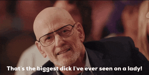 a bald man with glasses says " that 's the biggest dick i 've ever seen on a lady ! "