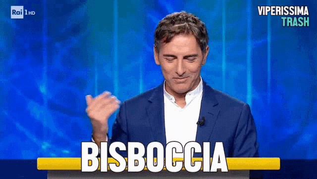 a man in a suit stands in front of a screen that says bisboccia on it