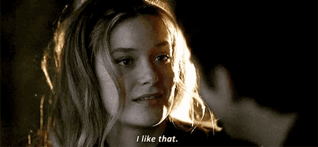 a man and a woman are looking at each other and the woman is saying `` i like that . ''