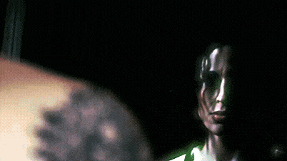 a blurred image of a person holding a microphone