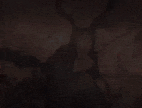 a blurry picture of a man with a sword in his hand