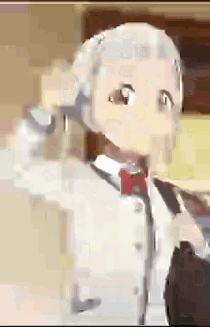 a close up of a cartoon character wearing a bow tie .