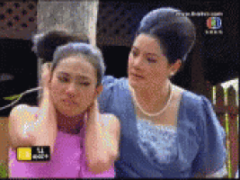 a couple of women standing next to each other on a television screen