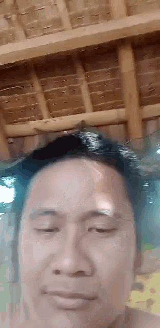 a close up of a man 's face with his eyes closed