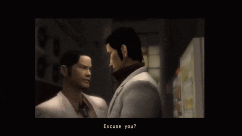 two men are standing next to each other in a dark room and one of them is asking the other to excuse him
