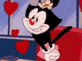 a cartoon character is sitting on a red couch with hearts in the background .