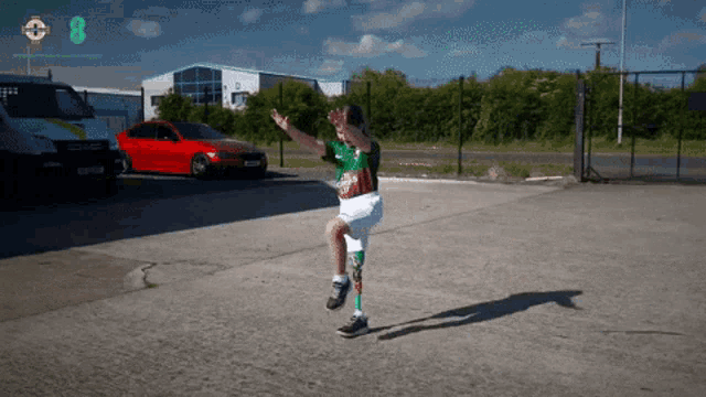 a boy with a prosthetic leg is playing soccer