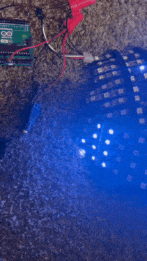 a bunch of wires are connected to a device that is glowing blue