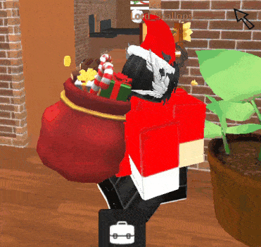 a person in a santa hat is carrying a bag of presents