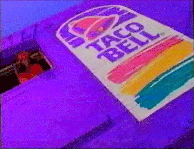 a purple car with a taco bell advertisement on it