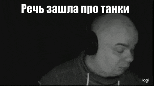 a black and white photo of a bald man wearing headphones with the word logi on the bottom