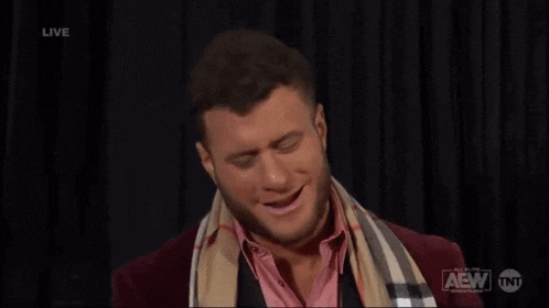 a man says we 're having fun while wearing a scarf