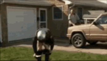 a man is kneeling down in front of a jeep