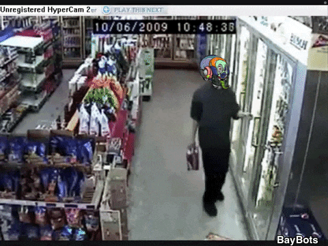 a video of a man walking through a store with the date 10/06/2009 on the bottom