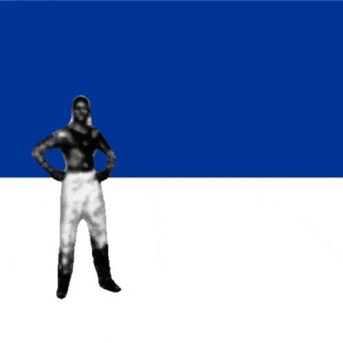 a man without a shirt is standing in front of a blue background