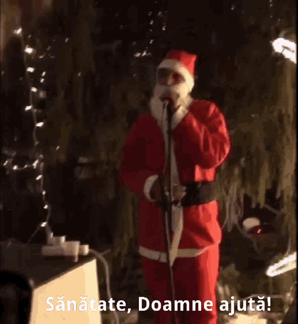 a person taking a picture of a man in a santa suit