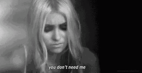 a black and white photo of a woman with the words `` you don 't need me '' written on her face .