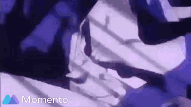 a purple background with the word momento in the upper right corner