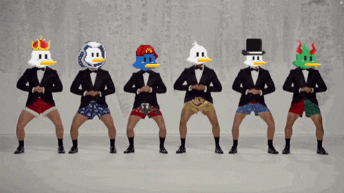a group of men in tuxedos and underwear with duck faces on their heads