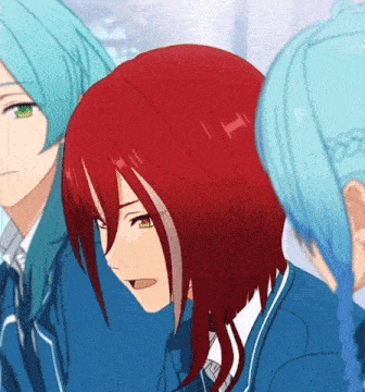 a girl with red hair and green eyes is wearing a blue school uniform .