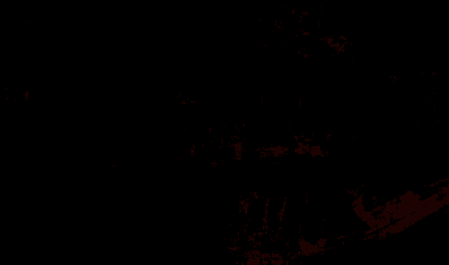 a shadow of a person is cast on a stone floor