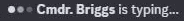 a blurry image of a text that says cmdr. briggs is typing