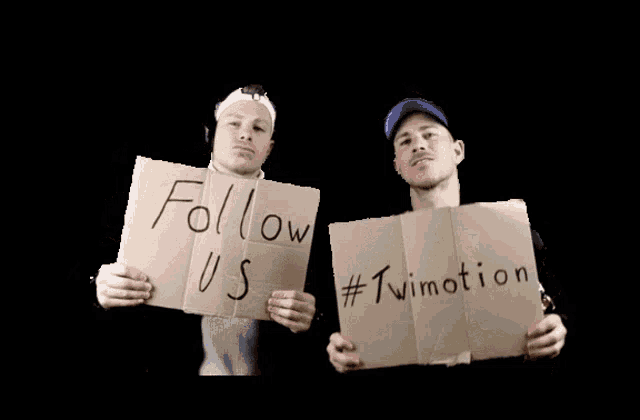 two men holding a cardboard sign that says follow us #twimotion