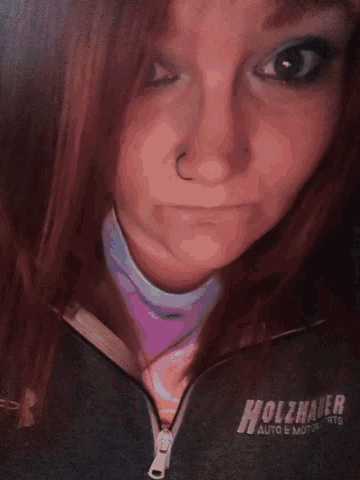 a close up of a woman 's face with the word hollister on the bottom