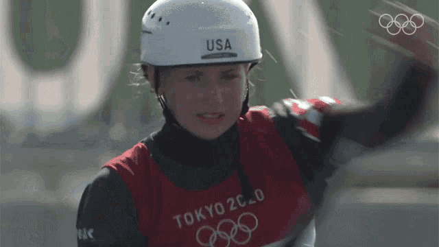 a woman wearing a helmet that says usa
