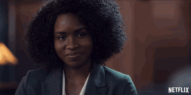 a close up of a woman 's face with the word netflix on the bottom