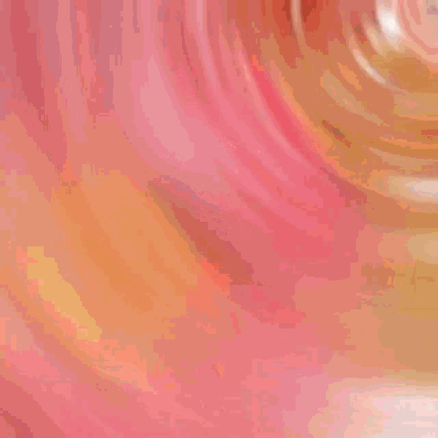 a blurred image of a flower with a pink center