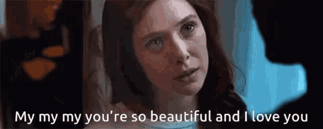 a close up of a woman 's face with the words `` my my my you 're so beautiful and i love you '' .