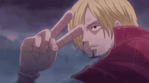 a close up of a person making a peace sign