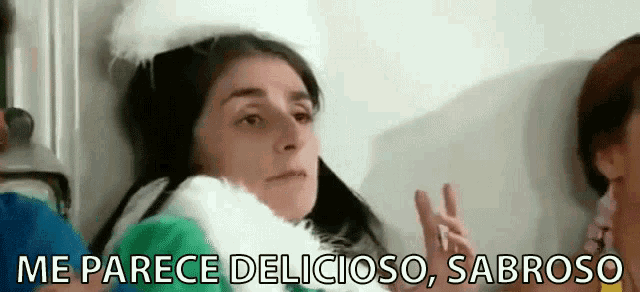 a woman in a green and white sweater says me parece deliciouso sabroso