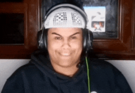 a man wearing headphones and a headband that says " a " on it