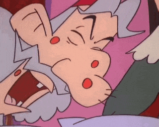 a cartoon character is laying on a bed with his mouth open and a surprised look on his face .