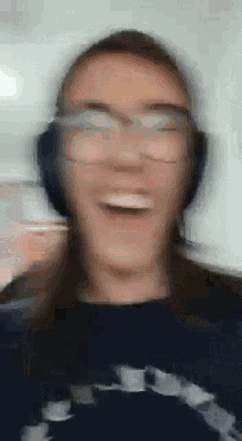 a blurry picture of a person wearing headphones