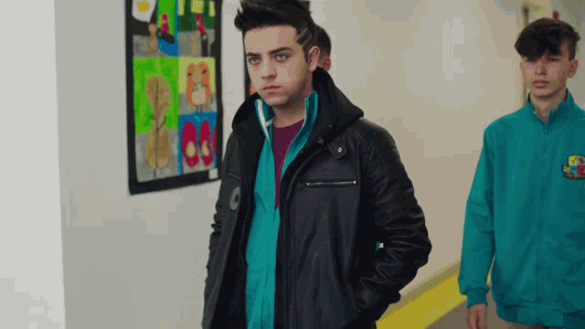 a boy wearing a blue jacket that says fc barcelona