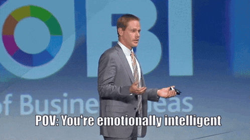 a man in a suit and tie is giving a presentation with the words pov you 're emotionally intelligent