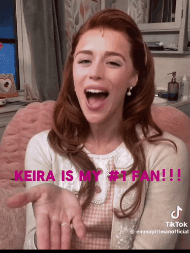 a woman with her mouth open and the words keira is my # 1 fan written above her