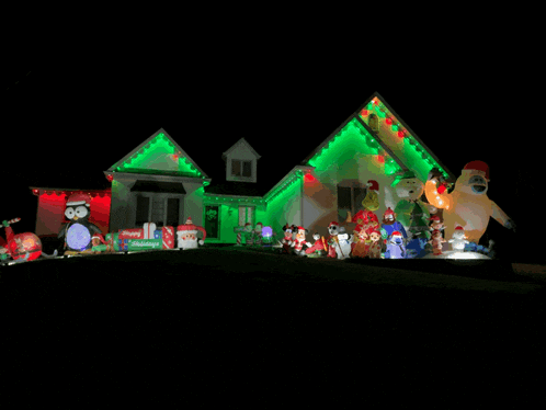 a house with christmas decorations and a sign that says ' christmas ' on it