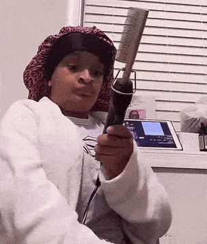 a person holding a comb and a hair straightener
