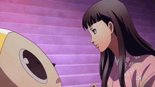 a woman in a pink kimono looks at a cartoon character