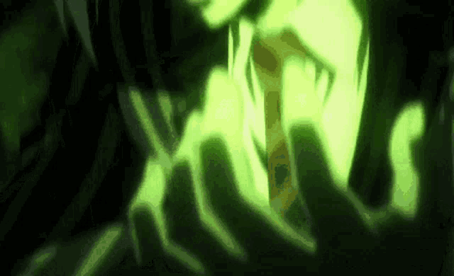 a close up of a person 's face with green light coming out of it .