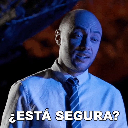a man in a suit and tie is asking " esta segura "