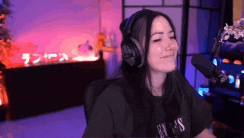 a woman wearing headphones and a t-shirt that says guns n ' roses