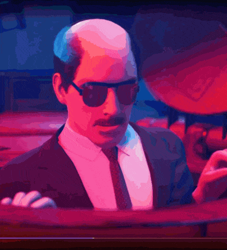a man in a suit and tie is wearing sunglasses and a mustache