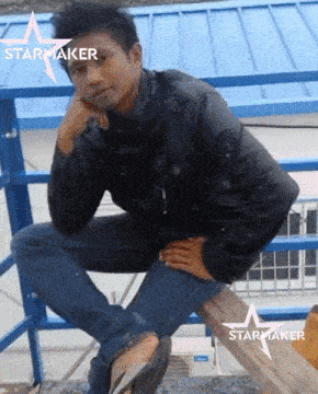 a man sitting on a wooden bench with a starmaker logo on the bottom right