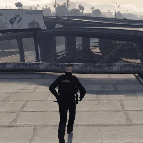 a police officer is standing in front of a billboard that says sebastian diaz