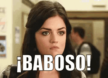a close up of a woman 's face with the words baboso written on it